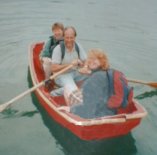 Our trusty red, plywood dinghy in happy times