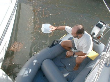 Bailing out the dinghy after the rains begin